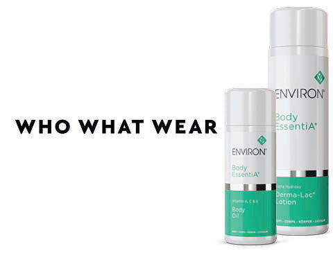 Two white and green environ body essentia lotion bottles with silver bands.