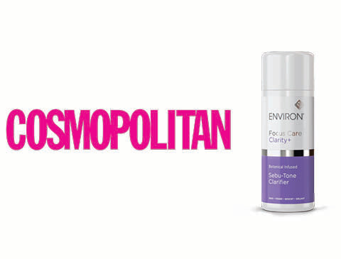 A sleek, cylindrical white and purple spray bottle of environ focus care clarify+ seb-tone clarifier with a silver cap.