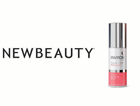 Silver and pink environment focus 24h moisturiser bottle with a sleek metallic cap
