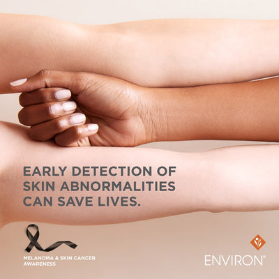 Two arms with different skin tones, one hand gently resting on the other forearm.