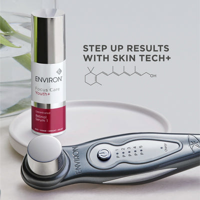 Silver and black environ skin tech+ facial device with a sleek, ergonomic design featuring control buttons and an indicator light.