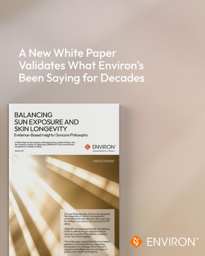 White paper with black text and a gold gradient background, featuring the title ’balancing sun exposure and skin longevity’ by environ.