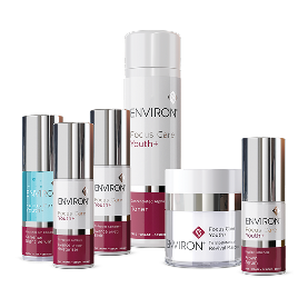 The image displays a collection of environ skincare products, including serums and creams in sleek white and silver cylindrical containers with maroon accents.