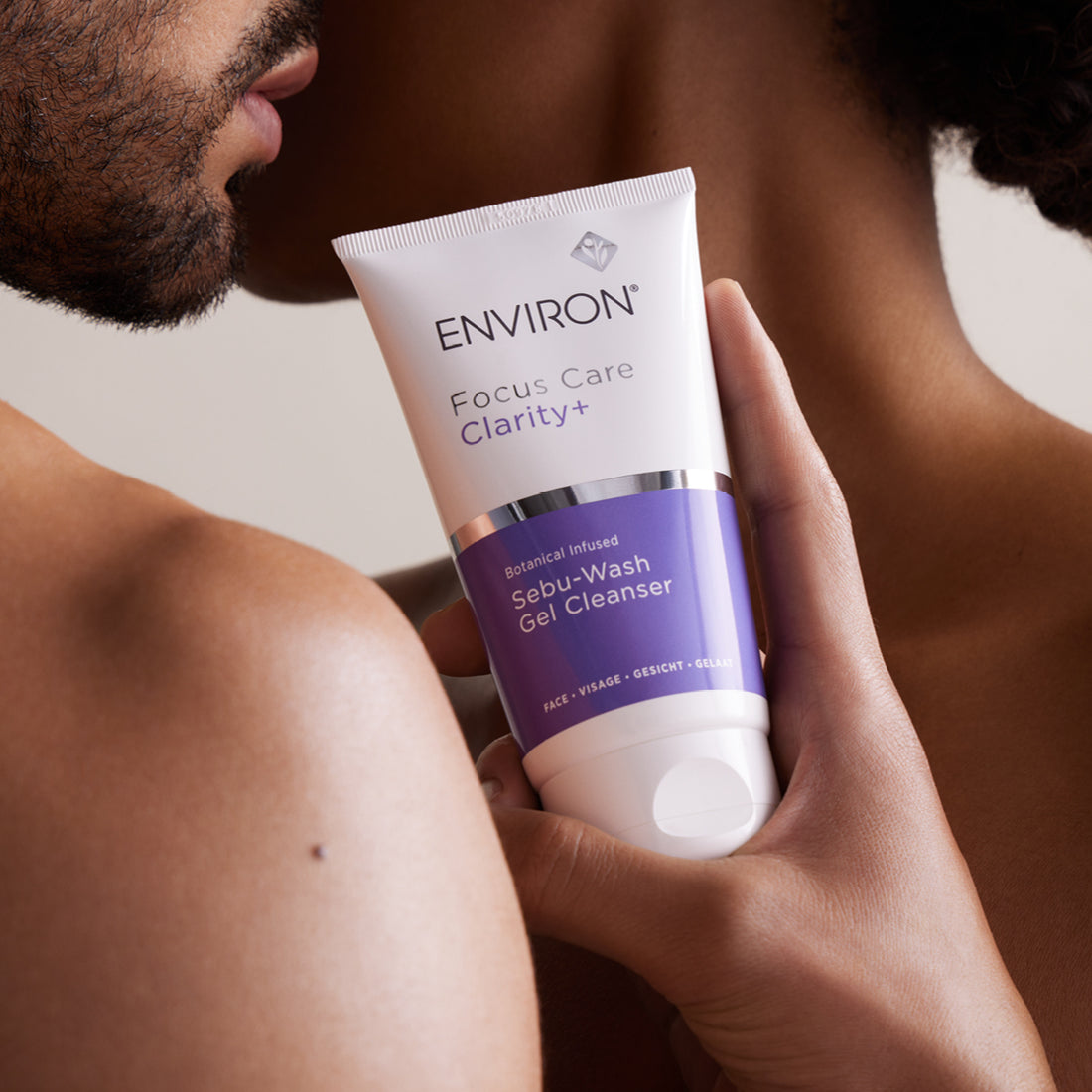 A white and purple tube of environ focus care clarity+ botanical infused sebu-wash gel cleanser.