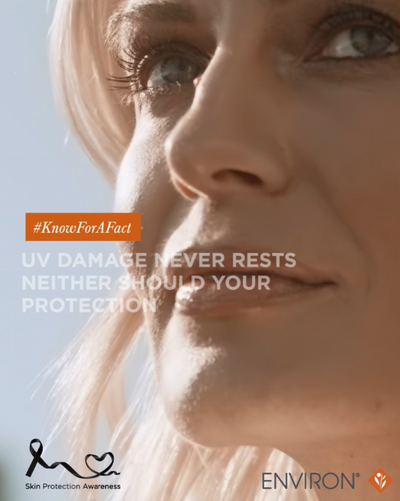 A close-up of a woman’s face with blonde hair and blue eyes, softly lit by sunlight.