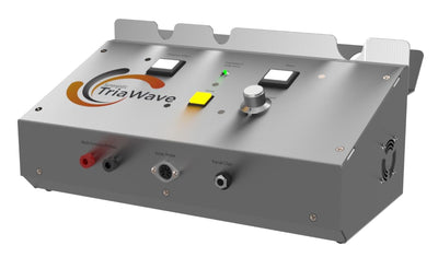 Gray metallic box with a curved orange and black logo, two square buttons, one yellow button, and a silver knob on the top surface.