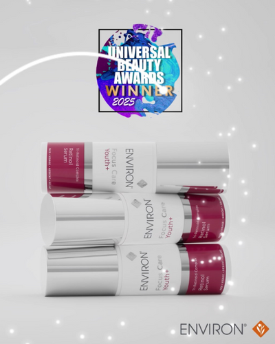 Three sleek silver cylindrical bottles of environ focus care youth+ retinol serum, each with a white label and maroon accent band.