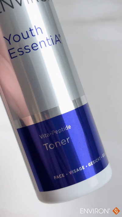 Silver and blue cylindrical bottle of environ youth essentia vita-peptide toner.