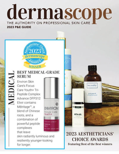 Silver and maroon cylindrical serum bottle with a white label reading ’environ focus care+ youth+’
