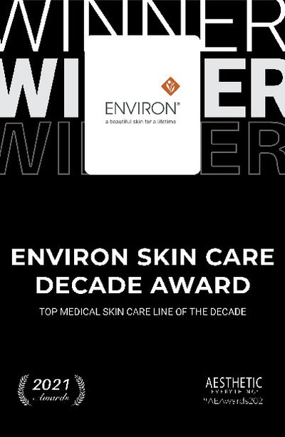 White rectangular plaque with the environ logo and tagline ’a beautiful skin for a lifetime’ centered on it.