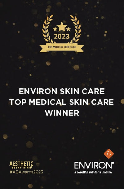 Environ skin care’s 2023 top medical skin care winner award plaque, featuring gold laurel wreaths and stars on a black background with sparkling golden accents.