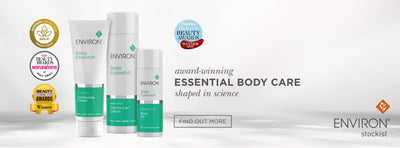 White and teal environ body essentia skincare tubes with minimalist design.