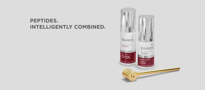 Two silver-topped, maroon-labeled environ skincare bottles and a gold-toned roller device.