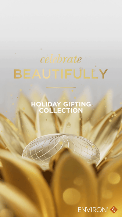 A translucent, spherical gift box with a delicate wireframe design sits nestled among golden floral elements.