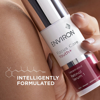 A sleek white and burgundy bottle of environ focus care youth+ concentrated retinol serum 1, featuring a metallic silver cap.