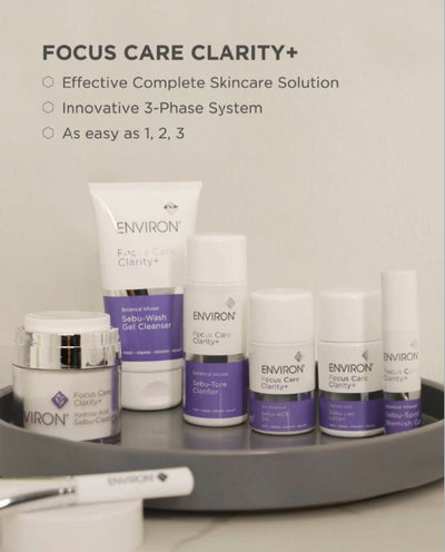 White and purple environ focus care clarity+ skincare product set with sleek, minimalist packaging.