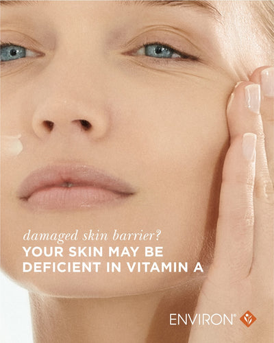 A dollop of creamy white vitamin a skincare product being applied to the cheek.