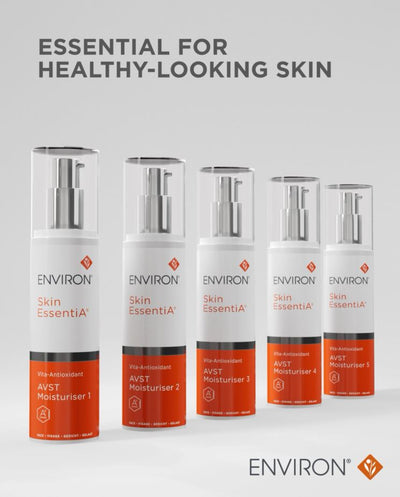 Five sleek white and orange pump bottles of environ skin essentia avst moisturiser, each with a silver nozzle.