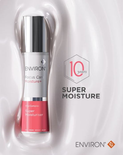 Silver and pink environ focus care moisture+ super moisturiser bottle with a sleek, cylindrical design.