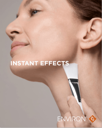 A sleek white and black makeup brush with a silver accent, branded as environ.