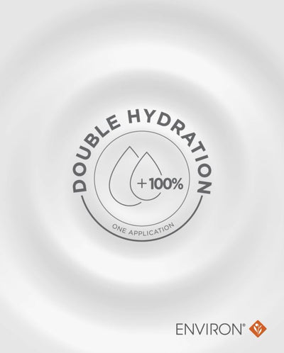 The image features a minimalist, circular logo with the text ’double hydration +100% one application’ and two stylized water droplets at its center.