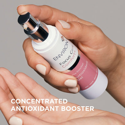 White and pink environ focus care comfort+ vita-enriched antioxidant gel bottle with a chrome spray nozzle.