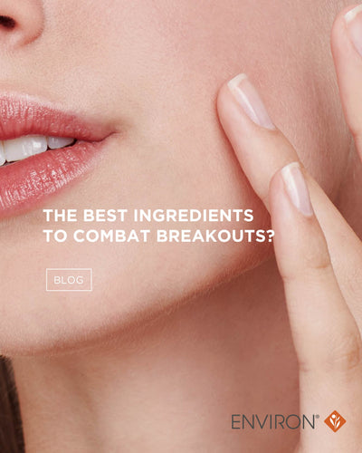A close-up of a woman’s face with soft, natural-looking skin and glossy coral-pink lips.