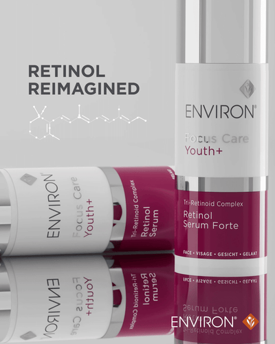A sleek, cylindrical bottle of environ focus care youth+ retinol serum forte with a white and deep magenta label design.