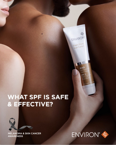 A sleek white and gold tube of environ ever pure sun care with spf 15.