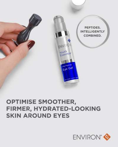 Silver and blue cylindrical bottle of environ youth essential anti-peptide eye gel with a silver pump dispenser.