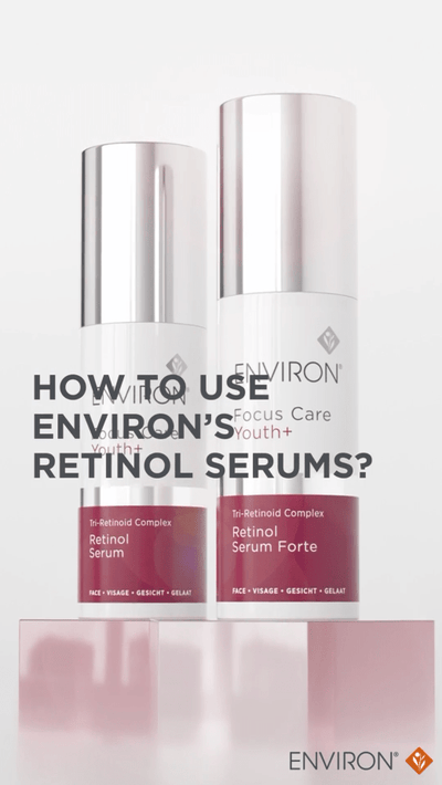 Two sleek white and silver envion retinol serum bottles with maroon labels, featuring ’retinol serum’ and ’retinol serum forte.’