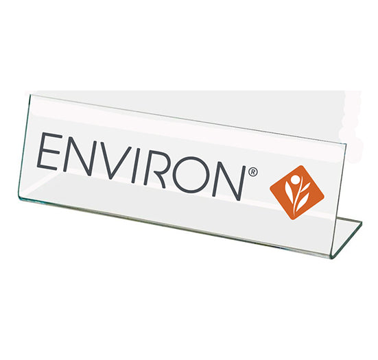 A clear acrylic desk sign prominently displays the Environ brand name and its signature orange diamond logo.
