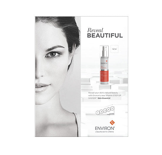 A woman with radiant skin features in an advertisement for the Environ Skin EssentiA Vitamin STEP-UP SYSTEM skincare product.