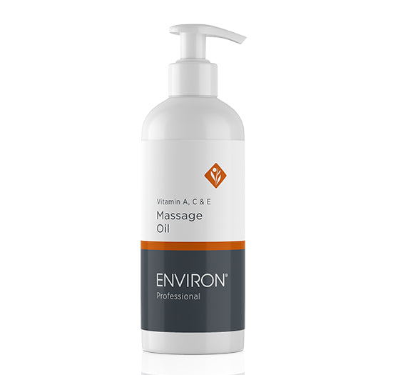 A sleek white pump bottle showcases Environ Professional Vitamin A, C &amp; E Massage Oil against a clean white background.